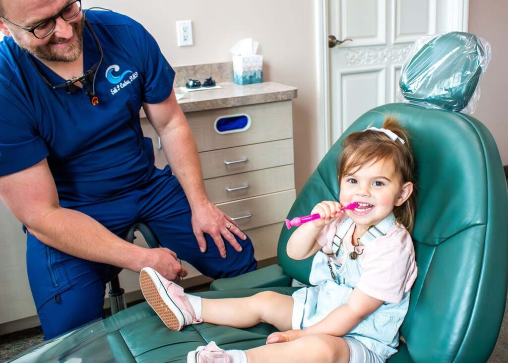 Dr. Cadra with a pediatric patient.